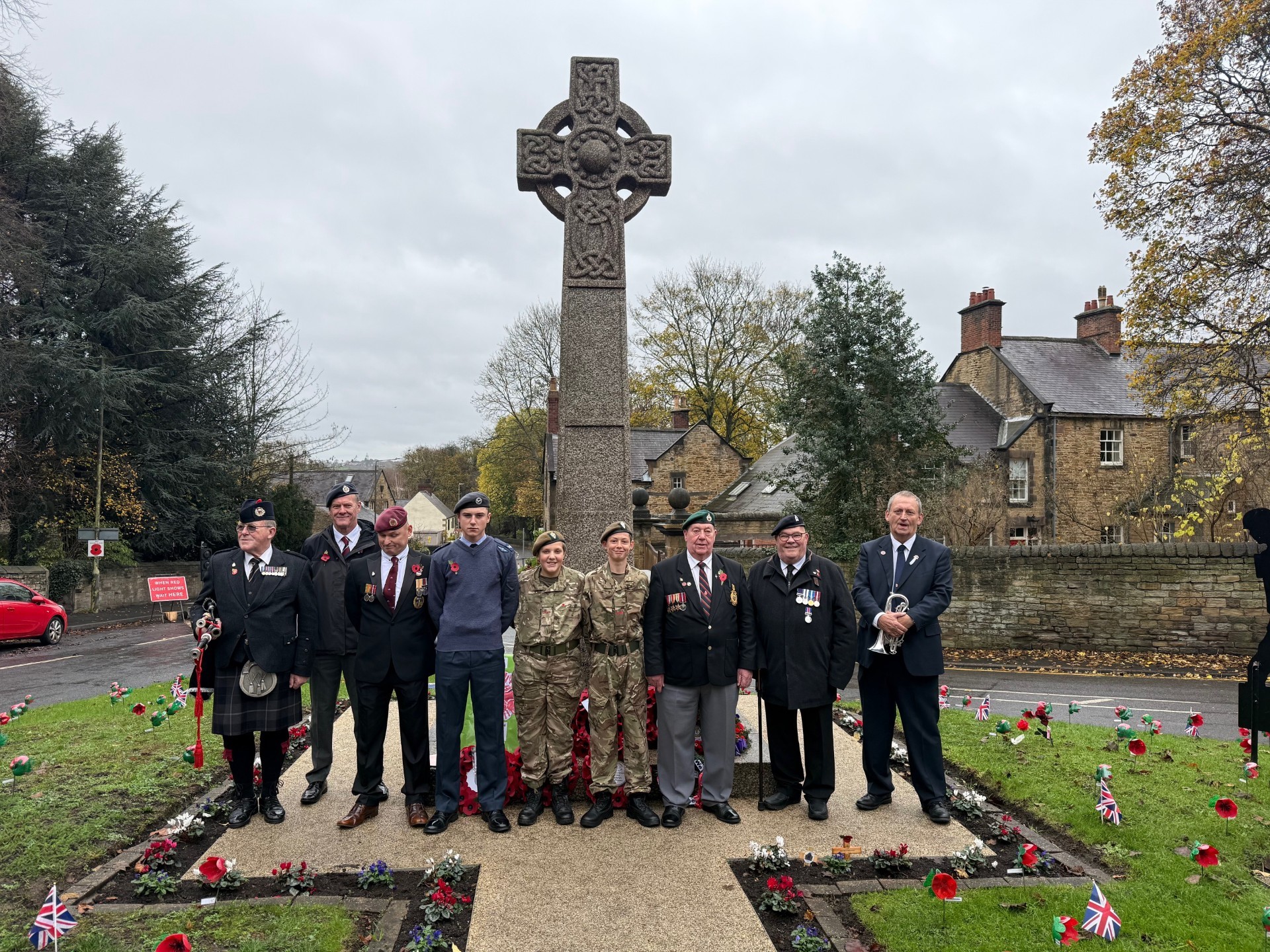 Eckington students (Max, George, and Callum) and veterans at the Eckington Cenotaph
